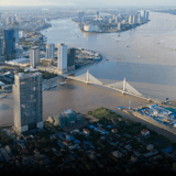 Phnom Penh from above, where the rivers meet, with a cable-stayed bridge and the city skyline